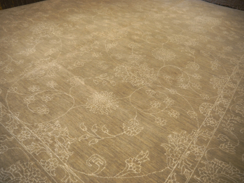 This original hand-knotted Agra Style Rug measures 9 x 12 ft and goes well with interior design styles. The pale and faded color gives it a cool look. 15653