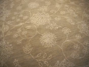 This original hand-knotted Agra Style Rug measures 9 x 12 ft and goes well with interior design styles. The pale and faded color gives it a cool look. 15653